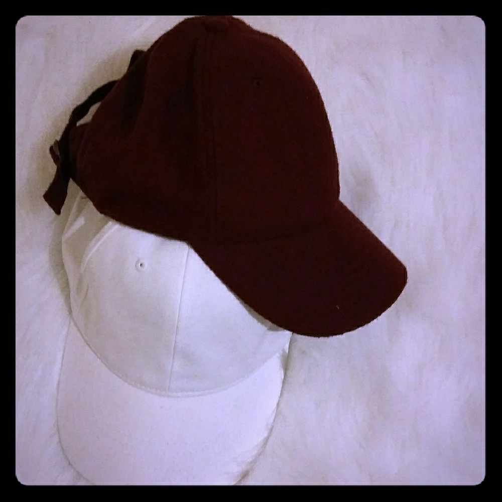 Pink and white baseball caps